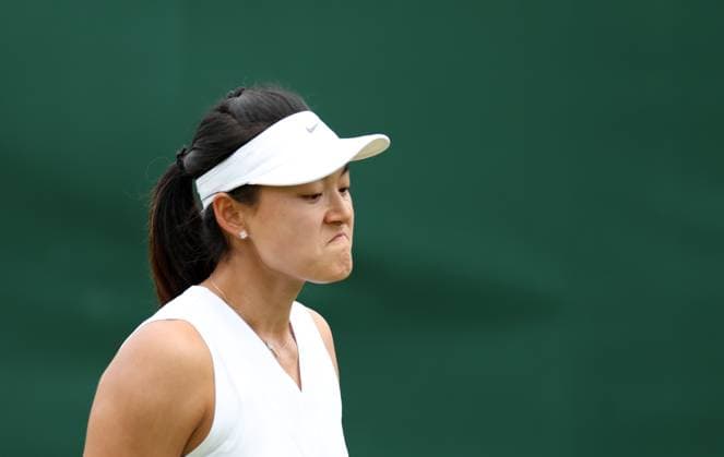 (240702) -- LONDON, July 2, 2024 -- Wang Yafan reacts during the women s singles first round match between Wang Yafan of China and Anna Karolina Schmiedlova of Slovakia at Wimbledon tennis Championship in London, Britain, on July 1, 2024. ) (SP)BRITAIN-LONDON-TENNIS-WIMBLEDON LixYing 