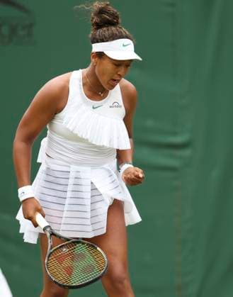 (240702) -- LONDON, July 2, 2024 -- Osaka Naomi reacts during the women s singles first round match between Osaka Naomi of Japan and Diane Parry of France at Wimbledon tennis Championship in London, Britain, on July 1, 2024. ) (SP)BRITAIN-LONDON-TENNIS-WIMBLEDON HanxYan 