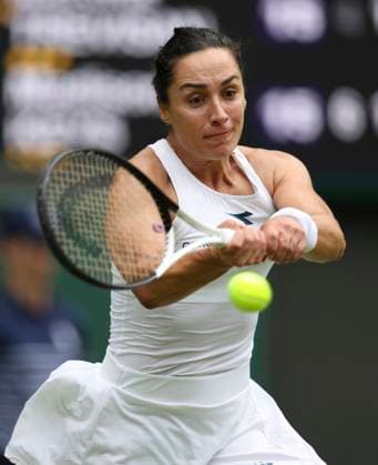 (240702) -- LONDON, July 2, 2024 -- Martina Trevisan hits a return during the women s singles first round match between Madison Keys of the United States and Martina Trevisan of Italy at Wimbledon tennis Championship in London, Britain, on July 1, 2024. ) (SP)BRITAIN-LONDON-TENNIS-WIMBLEDON HanxYan 