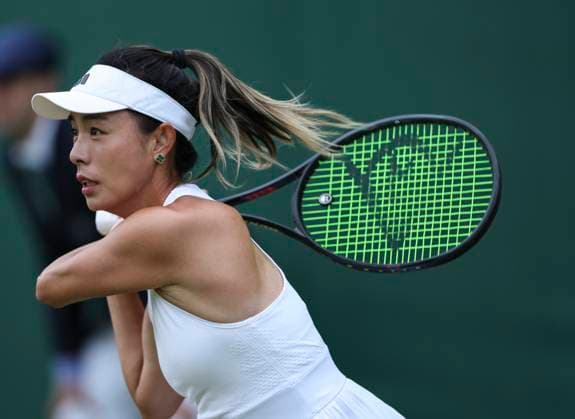 (240702) -- LONDON, July 2, 2024 -- Wang Qiang hits a return during the women s singles first round match between Wang Qiang of China and Emma Navarro of the United States at Wimbledon tennis Championship in London, Britain, on July 1, 2024. ) (SP)BRITAIN-LONDON-TENNIS-WIMBLEDON HanxYan 