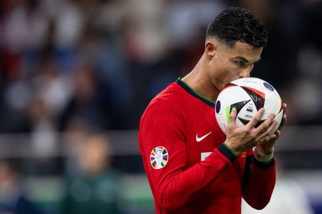 (240702) -- FRANKFURT, July 2, 2024 -- Cristiano Ronaldo of Portugal kisses the ball before taking a penalty kick during the UEFA EURO, EM, Europameisterschaft,Fussball 2024 Round of 16 match between Portugal and Slovenia in Frankfurt, Germany on July 1, 2024. ) (SP)GERMANY-FRANKFURT-FOOTBALL-EURO 2024-PORTUGAL VS SLOVENIA XiaoxYijiu 