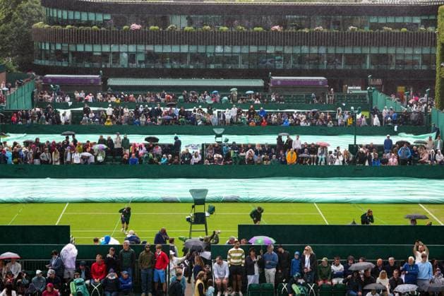 The covers are brought on as rain starts to fall Wimbledon Tennis Championships, Day 2, The All England Lawn Tennis and Croquet Club, London, UK - 02 Jul 2024  Copyright: xJavierxGarcia Shutterstockx 14567681a
