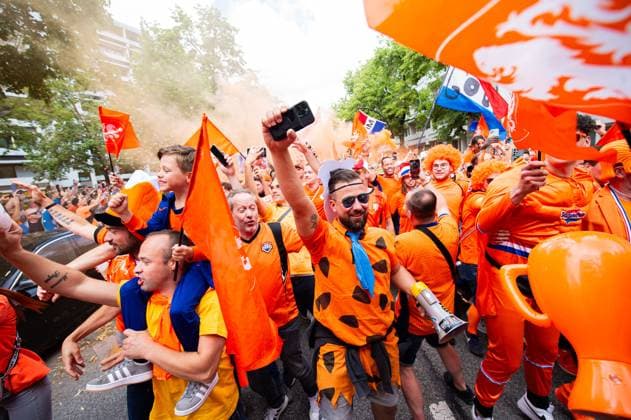 02 07 2024 Football, European Championship 2024 in Germany, fans in Munich Romania Netherlands Dutch fans before the match during the fan march near the Olympic Park In the picture they dance the song Left Right by Snollebollekes