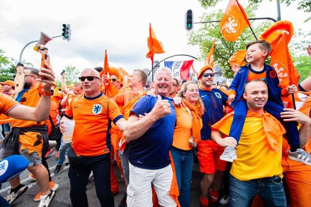 02 07 2024 Football, European Championship 2024 in Germany, fans in Munich Romania Netherlands Dutch fans before the match during the fan march near the Olympic Park In the picture they dance the song Left Right by Snollebollekes