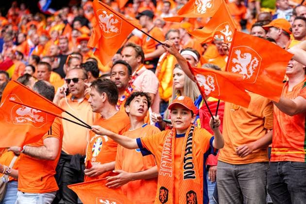 2024-07-02 Romania v Netherlands - Round of 16 - UEFA EURO, EM, Europameisterschaft,Fussball 2024 MUNICH, GERMANY - JULY 2: Fans of the Netherlands waving flags during the Round of 16 - UEFA EURO 2024 match between Romania and Netherlands at Munich Football Arena on July 2, 2024 in Munich, Germany. (Photo by Joris Verwijst BSR Agency) Munich Germany Content not available for redistribution in The Netherlands directly or indirectly through any third parties. Copyright: xBSRxAgencyx