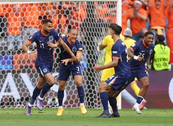 Cody Gakpo of Netherlands celebrates scoring to make it 0-1 with Xavi Simons of Netherlands Romania v Netherlands, UEFA European Championship, EM, Europameisterschaft 2024, Round of 16, Football, Munich Football Arena, Munich, Germany - 02 Jul 2024 EDITORIAL USE ONLY No use with unauthorised audio, video, data, fixture lists, club league logos or live services. Online in-match use limited to 120 images, no video emulation. No use in betting, games or single club league player publications. Copyright: xPaulxCurrie Shutterstockx 14566647bb