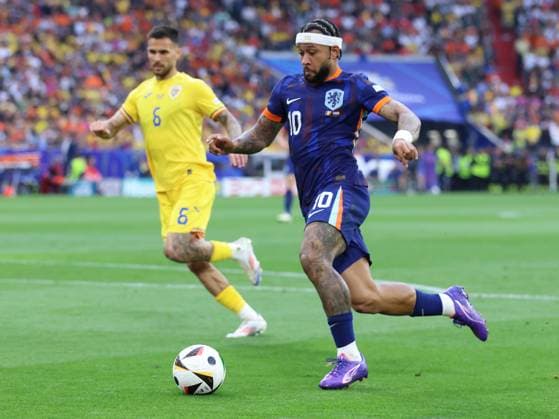 Soccer UEFA EURO 2024 Round of 16 Romania Netherlands on 02 07 2024 at the Munich Football Arena in Munich Memphis Depay Netherlands , front Marius Marin Romania , back xMSx