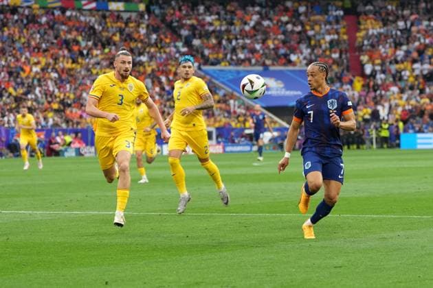 Radu Dragusin 3 Romania and Xavi Simons 7 Netherlands in action during the Round of 16 match of the European Championship Romania Netherlands on 02 07 2024 in Munich Munich Football Arena Bayern Germany
