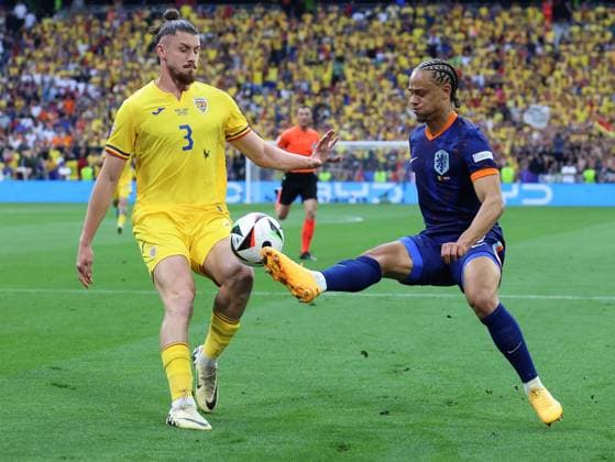 Soccer UEFA EURO 2024 Round of 16 Romania Netherlands on 02 07 2024 at the Munich Football Arena in Munich Radu Dragusin Romania , left Xavi Simons Netherlands , right xMSx