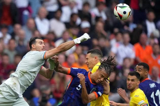 Romania s goalkeeper Florin Nita fight for the ball with Nathan Ake of the Netherlands during the Euro 2024 soccer match between Romania and Netherlands at the Munich Football Arena , Munich , Germany - Tuesday July 2 , 2024. - Soccer .  Copyright: xSpada LaPressex