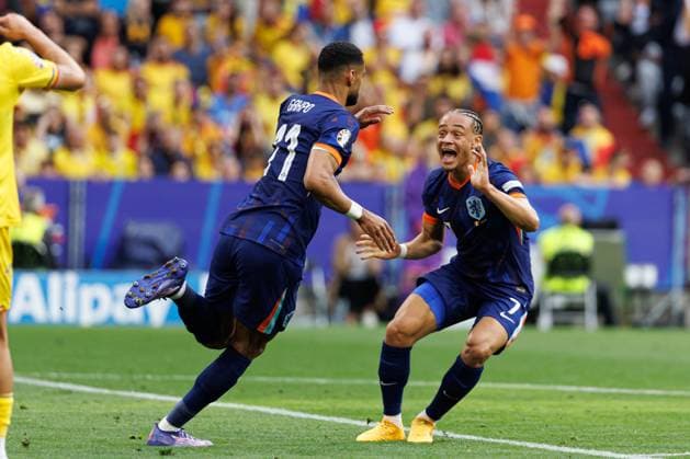 Cody Gakpo seen celebrating after scoring goal with Xavi Simons during UEFA EURO, EM, Europameisterschaft,Fussball 2024 Round of 16 game between national teams of Romania and Netherlands at Allianz Arena, Munich, Germany (Maciej Rogowski) Munich Allianz Arena Germany Copyright: xMaciejxRogowskix nedrom