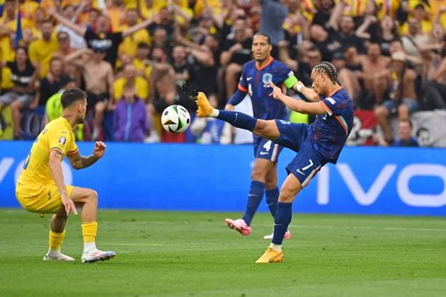 Xavi SIMONS NED , action,duel against Marius MARIN ROM Round of 16 Romania ROU Netherlands NED on 02 07 2024, Football Arena Munich Football UEFA EURO 2024 GERMANY from 14 06 2024 14 07 2024