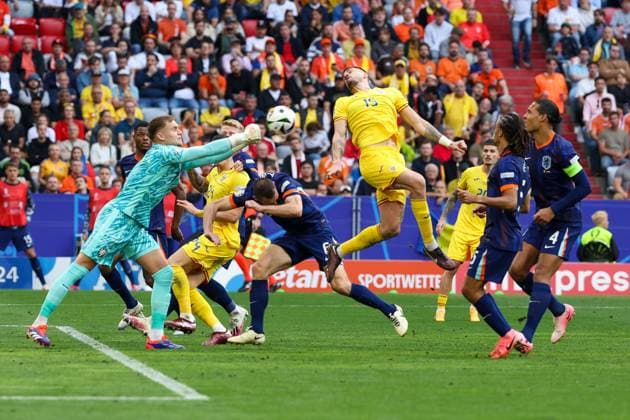 in duel, action, with Bart Verbruggen 1 Netherlands , Andrei Burca 15 Romania , Romania vs Netherlands, Football, UEFA Euro 2024, Round of 16, M43, 02 07 2024 Munich Bavaria Germany Copyright: xkolbert-press ChristianxKolbertx