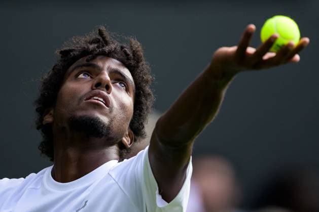 240702 Elias Ymer of Sweden competes in a first round singles match during day 2 of Wimbledon on July 2, 2024 in London Photo Jesper Zerman BILDBYRAN kod JZ JZ0548 tennis wimbledon aeltc day 2 bbeng  Copyright: JESPERxZERMAN BB240702JZ051