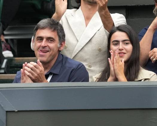 Lawn Tennis - 2024 Wimbledon Championship - Vic Kopriva (CZE) v Novak Djokovic (SRB) - All England Lawn Tennis & Croquet Club - Tuesday 2nd July 2024 Snooker player, Ronnie O™Sullivan applauds a Novak Djokovic shot with his daughter 