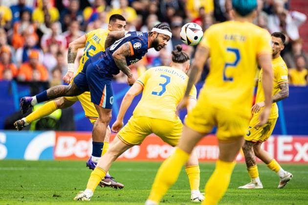 UEFA EURO 2024 Romania Netherlands 02 07 2024 Memphis Depay Netherlands, 10 , Andrei Burca Romania, 15 UEFA EURO 2024 Romania Netherlands Munich Football Arena, Munich 02 07 2024 Copyright: xBEAUTIFULxSPORTS Buriakovx