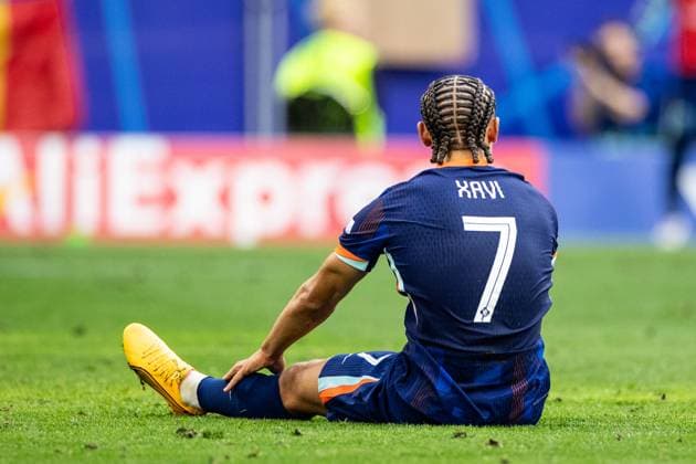 UEFA EURO 2024 Romania Netherlands 02 07 2024 Xavi Simons Netherlands, 7 with the emotions, sits on the pitch after the shuss UEFA EURO 2024 Romania Netherlands Munich Football Arena, Munich 02 07 2024 Copyright: xBEAUTIFULxSPORTS Buriakovx