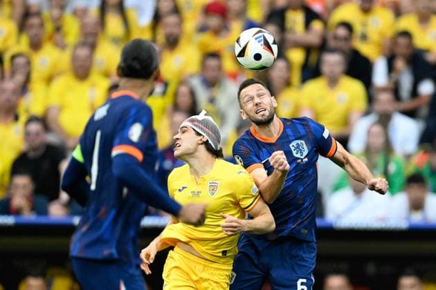 Picture shows duel Hagi 10, Romania with Stefan de Vrij 6, Netherlands , 02 07 2024, Munich, Soccer, European Championship, Romania Netherlands, EVENT REGULATIONS PROHIBIT ANY USE OF PHOTOGRAPHS AS IMAGE SEQUENCES AND OR QUASI VIDEO xklx