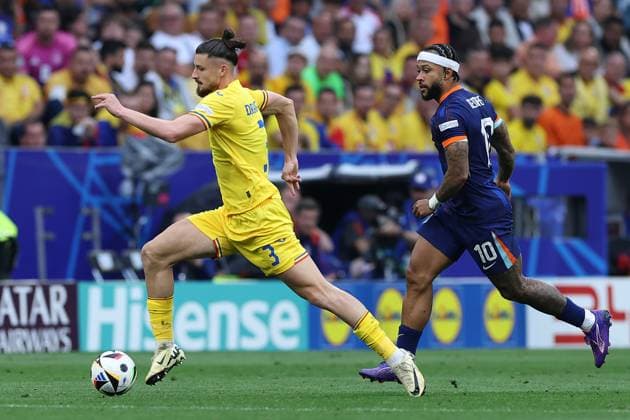 Soccer UEFA EURO 2024 Round of 16 Romania Netherlands on 02 07 2024 at the Munich Football Arena in Munich Radu Dragusin Romania , left Memphis Depay Netherlands , right xMSx