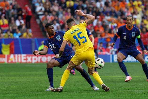 in duel, action, with Denzel Dumfries 22 Netherlands , Andrei Burca 15 Romania , Romania vs Netherlands, Football, UEFA Euro 2024, Round of 16, M43, 02 07 2024 Munich Bavaria Germany Copyright: xkolbert-press ChristianxKolbertx
