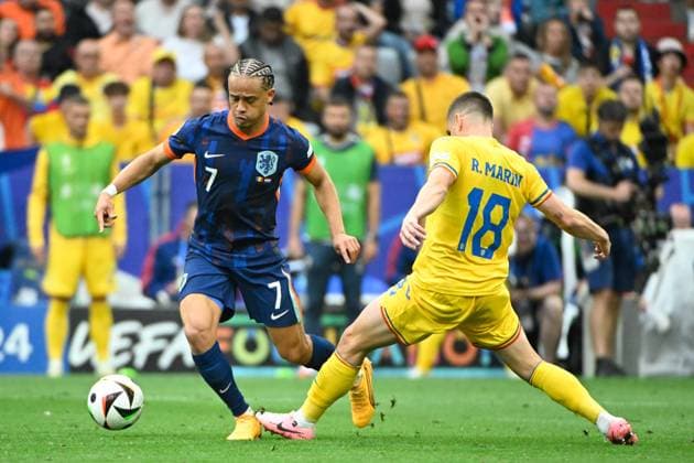 Picture shows from left to right Xavi Simons 7, Netherlands , R Marin 18, Romania , 02 07 2024, Munich, Soccer, European Championship, Romania Netherlands, EVENT REGULATIONS PROHIBIT ANY USE OF PHOTOGRAPHS AS IMAGE SEQUENCES AND OR QUASI VIDEO xklx