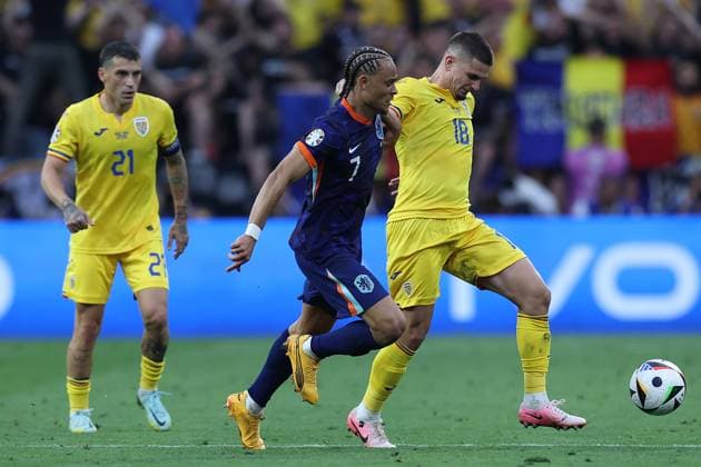 Soccer UEFA EURO 2024 Round of 16 Romania Netherlands on 02 07 2024 at the Munich Football Arena in Munich Nicolae Stanciu Romania , left Xavi Simons Netherlands , center Razvan Marin Romania , right xMSx