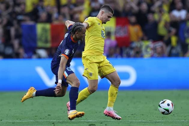 Soccer UEFA EURO 2024 Round of 16 Romania Netherlands on 02 07 2024 at the Munich Football Arena in Munich Xavi Simons Netherlands , left Razvan Marin Romania , right xMSx