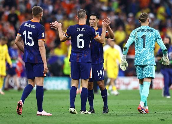 Tijjani Reijnders of Netherlands celebrates with Stefan de Vrij of Netherlands at full time Romania v Netherlands, UEFA European Championship, EM, Europameisterschaft 2024, Round of 16, Football, Munich Football Arena, Munich, Germany - 02 Jul 2024 EDITORIAL USE ONLY No use with unauthorised audio, video, data, fixture lists, club league logos or live services. Online in-match use limited to 120 images, no video emulation. No use in betting, games or single club league player publications. Copyright: xMichaelxZemanek Shutterstockx 14566637bv