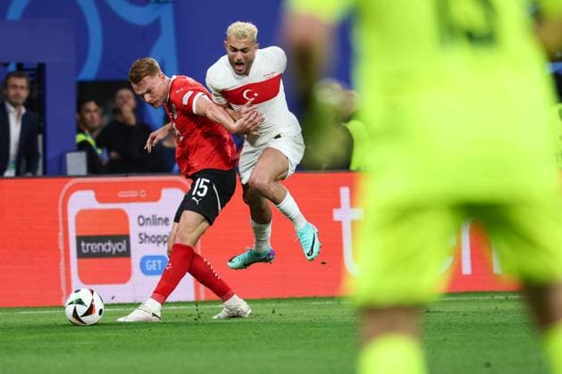 SOCCER - UEFA EURO, EM, Europameisterschaft,Fussball 2024 LEIPZIG,GERMANY,02.JUL.24 - UEFA EURO 2024, round of 16, Austria vs Turkey. Image shows Philipp Lienhart (AUT) and Baris Alper Yilmaz (TUR).  GEPAxpictures xArminxRauthner