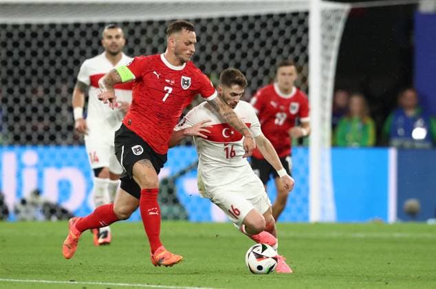 02 07 2024, xtgx, Football EM 2024 1 8 Final, Austria Turkey emspor, v l Marko Arnautovic Austria , Ismail Yüksek Turkey Turkey UEFA REGULATIONS PROHIBIT ANY USE OF PHOTOGRAPHS as IMAGE SEQUENCES and or QUASI VIDEO Leipzig