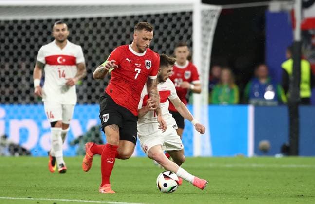02 07 2024, xtgx, Football EM 2024 1 8 Final, Austria Turkey emspor, v l Marko Arnautovic Austria , Ismail Yüksek Turkey Turkey UEFA REGULATIONS PROHIBIT ANY USE OF PHOTOGRAPHS as IMAGE SEQUENCES and or QUASI VIDEO Leipzig