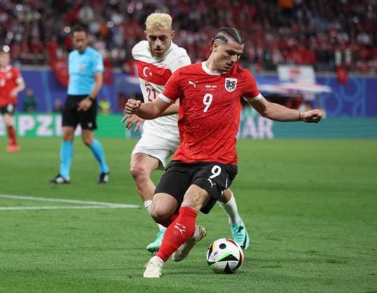 Leipzig, Germany, 2nd July 2024. Marcel Sabitzer of Austria (R) is challenged by Baris Alter Yilmaz of Turkey during the UEFA European Championships Round of 16 match at Leipzig Stadium, Leipzig. Picture credit should read: Paul Terry Sportimage EDITORIAL USE ONLY. No use with unauthorised audio, video, data, fixture lists, club league logos or live services. Online in-match use limited to 120 images, no video emulation. No use in betting, games or single club league player publications. SPI-3215-0046