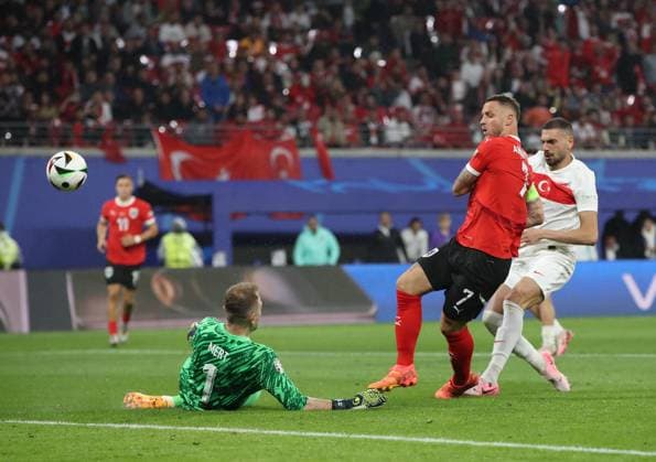 02 07 2024, xtgx, Football EM 2024 1 8 Final, Austria Turkey emspor, v l Mert Günok Turkey Turkey , Marko Arnautovic Austria , Merih Demiral Turkey Turkey UEFA REGULATIONS PROHIBIT ANY USE OF PHOTOGRAPHS as IMAGE SEQUENCES and or QUASI VIDEO Leipzig
