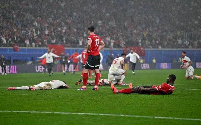 02 07 2024, Football UEFA EURO 2024, round of 16, Austria Turkey, in the RB Arena Leipzig, everyone is lying on the ground whether Turks or Austrians, in the middle Michael Gregoritsch Austria who is sad