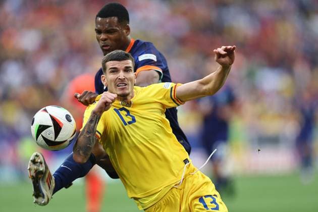 Denzel Dumfries (Netherlands)Valentin Mihaila (Romania) during the UEFA EURO, EM, Europameisterschaft,Fussball Germany 2024 match between Romania 0-3 Netherlands at Munich Football Arena on July 02, 2024 in Munich , Germany. Noxthirdxpartyxsales  (258440113)
