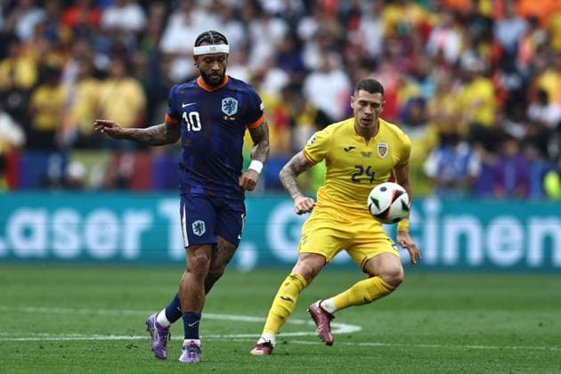 Memphis Depay (Netherlands)Bogdan Racovitan (Romania) during the UEFA EURO, EM, Europameisterschaft,Fussball Germany 2024 match between Romania 0-3 Netherlands at Munich Football Arena on July 02, 2024 in Munich , Germany. Noxthirdxpartyxsales  (258440143)