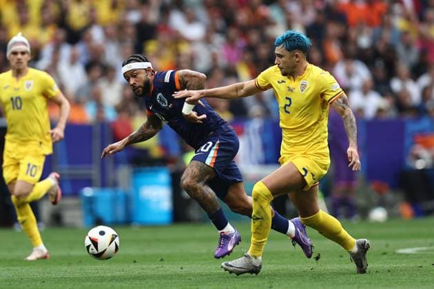 Memphis Depay (Netherlands)Andrei Ratiu (Romania) during the UEFA EURO, EM, Europameisterschaft,Fussball Germany 2024 match between Romania 0-3 Netherlands at Munich Football Arena on July 02, 2024 in Munich , Germany. Noxthirdxpartyxsales  (258440259)
