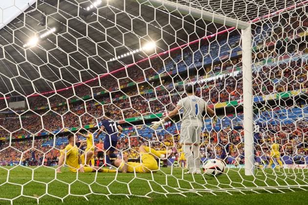(240703) -- MUNICH, July 3, 2024 -- Romania s goalkeeper Florin Constantin Nita (front) reacts after failing to save the goal by Donyell Malen of the Netherlands during the UEFA EURO, EM, Europameisterschaft,Fussball 2024 Round of 16 match between Romania and the Netherlands in Munich, Germany on July 2, 2024. ) (SP)GERMANY-MUNICH-FOOTBALL-EURO 2024-ROMANIA VS NETHERLANDS MengxDingbo 