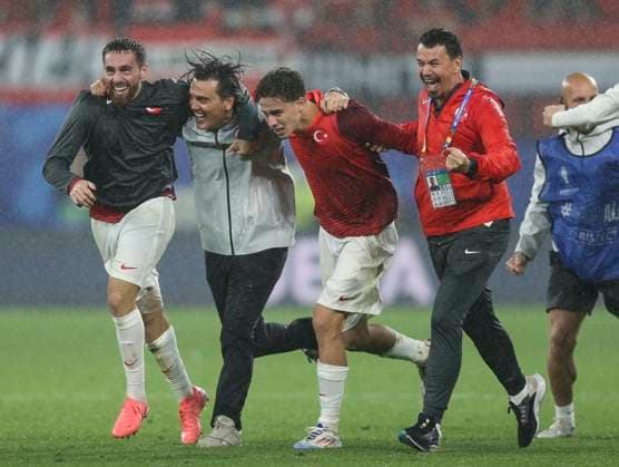 Football - 2024 UEFA European Championships Finals - Round of Sixteen - Austria vs Turkey - Leipzig Stadium - Tuesday 2nd July 2024 Turkey manager Vincenzo Montella celebrates with staff and players at full time as Turkey defeat Austria 2-1 to progress to the quarter finals of Euro 2024 