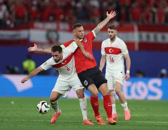 - Austria v Turkey, UEFA EURO, EM, Europameisterschaft,Fussball 2024, Round Of 16, Leipzig Football Stadium, Leipzig, Germany - 2nd July 2024. Orkun Kokcu of Turkey battles Marko Arnautovic of Austria. - Austria v Turkey, UEFA Euro 2024, Round Of 16, Leipzig Football Stadium, Leipzig, Germany - 2nd July 2024. Leipzig Leipzig Football Stadium Germany Copyright: xDanxWeirx CP_Austria_Turkey_75