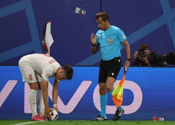 Leipzig, Germany, 2nd July 2024. Objects from the crowd are thrown in the direction towards Arda Guler of Turkey and the assistant referee during the UEFA European Championships Round of 16 match at Leipzig Stadium, Leipzig. Picture credit should read: Paul Terry Sportimage EDITORIAL USE ONLY. No use with unauthorised audio, video, data, fixture lists, club league logos or live services. Online in-match use limited to 120 images, no video emulation. No use in betting, games or single club league player publications. SPI-3215-0081