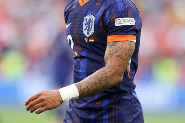 Tattoos on the arm of Memphis Depay of Netherlands Romania v Netherlands, UEFA European Championship, EM, Europameisterschaft 2024, Round of 16, Football, Munich Football Arena, Munich, Germany - 02 Jul 2024 EDITORIAL USE ONLY No use with unauthorised audio, video, data, fixture lists, club league logos or live services. Online in-match use limited to 120 images, no video emulation. No use in betting, games or single club league player publications. Copyright: xPaulxCurrie Shutterstockx 14566647ft