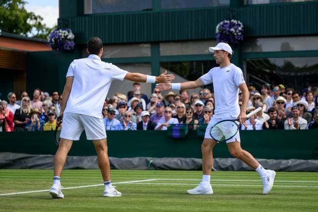 240704 Casper Ruud of Norway and William Blumberg of USA compete in a first round doubles match during day 4 of Wimbledon on July 4, 2024 in London Photo Jesper Zerman BILDBYRAN kod JZ JZ0550 tennis wimbledon dag 4 bbeng  Copyright: JESPERxZERMAN BB240704JZ022