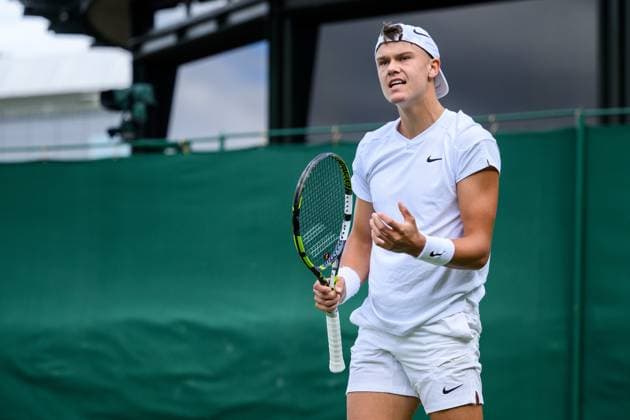 240704 Holger Rune of Denmark competes in a second round singles match during day 4 of Wimbledon on July 4, 2024 in London Photo Jesper Zerman BILDBYRAN kod JZ JZ0550 tennis wimbledon dag 4 bbeng  Copyright: JESPERxZERMAN BB240704JZ095