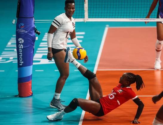 (240705) -- MANILA, July 5, 2024 -- Agripina Khayesi Kundu (bottom) of Kenya kicks the ball during the match between Puerto Rico and Kenya at the FIVB Women s Volleyball Challenger Cup 2024 in Manila, the Philippines, on July 4, 2024. ) (SP)PHILIPPINES-MANILA-VOLLEYBALL-FIVB WOMEN S CHALLENGER CUP 2024-PUERTO RICO VS KENYA ROUELLExUMALI 