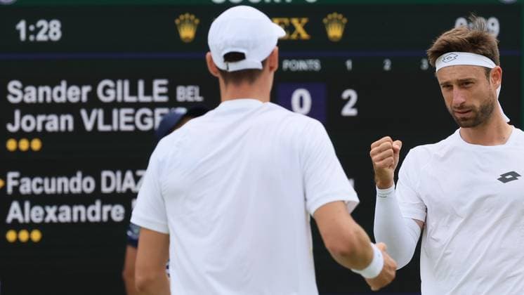 Belgian pair Joran Vliegen - Sander Gille pictured during a doubles tennis match against Argentinian pair Etcheverry-Cerundolo, in the first round of the gentlemen s doubles competition of the 2024 Wimbledon grand slam tournament at the All England Tennis Club, in south-west London, Britain, Friday 05 July 2024. BENOITxDOPPAGNE  x95874652x