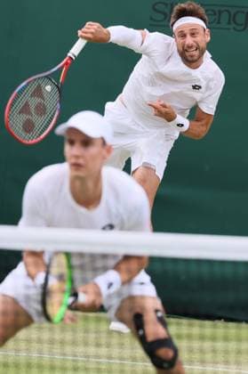 Belgian pair Joran Vliegen - Sander Gille pictured in action during a doubles tennis match against Argentinian pair Etcheverry-Cerundolo, in the first round of the gentlemen s doubles competition of the 2024 Wimbledon grand slam tournament at the All England Tennis Club, in south-west London, Britain, Friday 05 July 2024. BENOITxDOPPAGNE  x95876523x