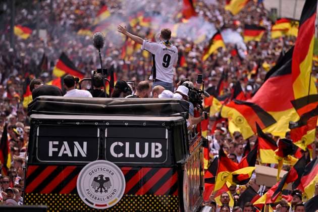 Fan march before the game, German fans, flags, flags, atmosphere, fan festival, fan club DFB with whipper-in Bierhoff 9 on double-decker bus EURO 2024 European Championship quarter-final Spain ESP vs Germany EURO 2024 European Championship quarter-final Spain ESP vs Germany
