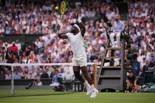 LONDON, ENGLAND - JULY 05: Frances Tiafoe of United States plays a high backhand volley against Carlos Alcaraz of Spain in his Gentlemen s Singles third round match during day five of The Championships Wimbledon 2024 at All England Lawn Tennis and Croquet Club on July 05, 2024 in London, England  Copyright: xHiroshixSatox