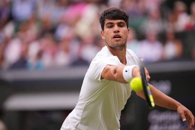 LONDON, ENGLAND - JULY 05: Carlos Alcaraz of Spain stretches to play a backhand against Frances Tiafoe of United States in his Gentlemen s Singles third round match during day five of The Championships Wimbledon 2024 at All England Lawn Tennis and Croquet Club on July 05, 2024 in London, England.  Copyright: xHiroshixSatox
